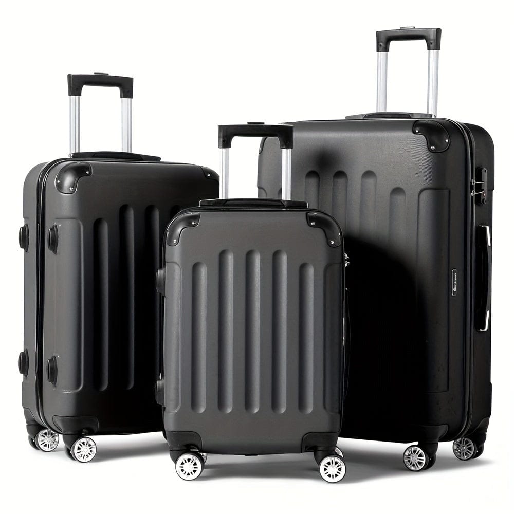 Three matte black rolling suitcases with vertical ribbed detailing and extended telescoping handles stand against a white background.