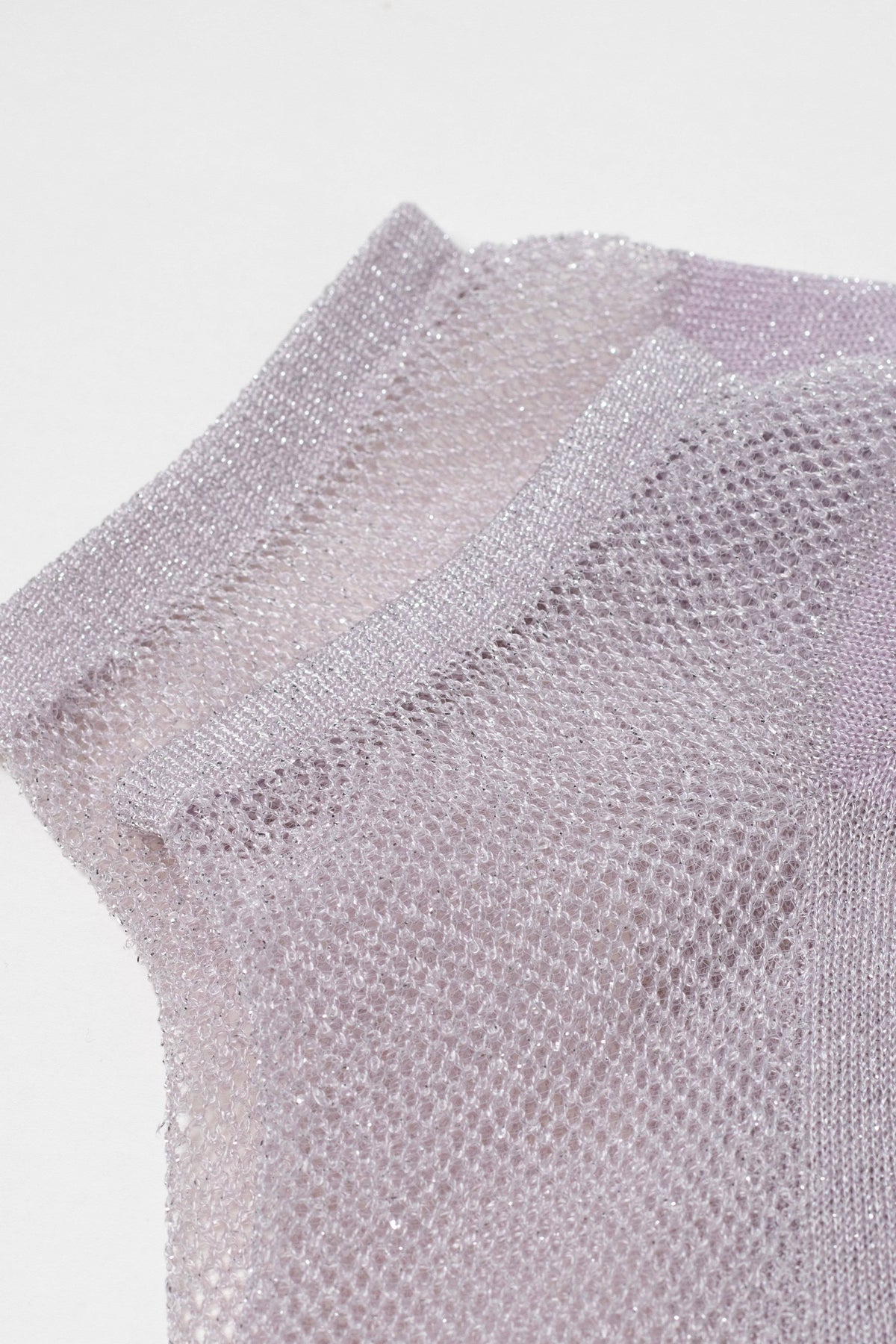 A pair of shimmering lavender ankle socks featuring a fine, semi-sheer mesh knit texture.