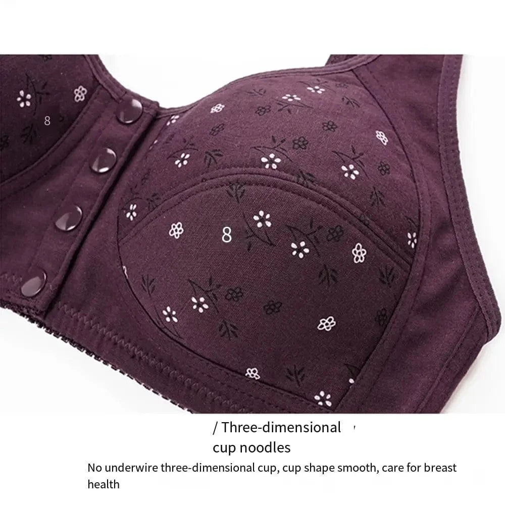A purple floral print bra with a front button closure and a contoured, three-dimensional cup design.