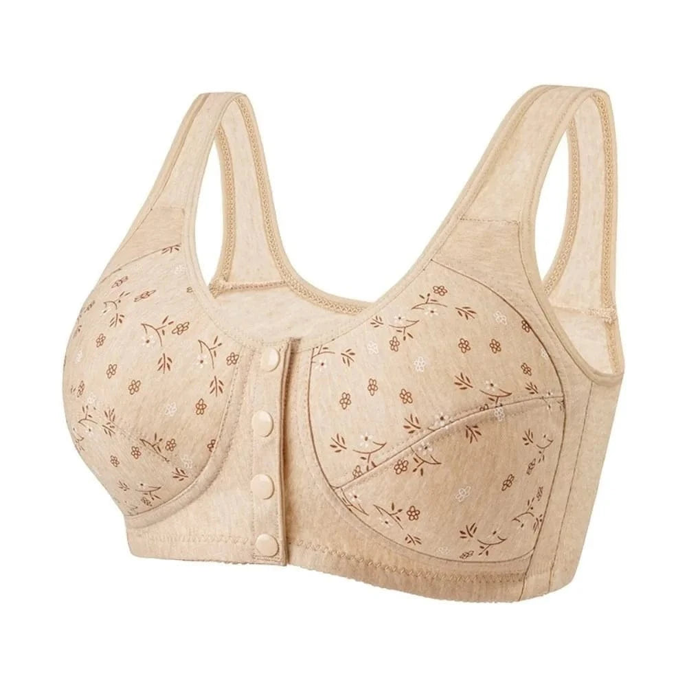 A beige front-closure wireless bra featuring a delicate brown and white floral pattern across the cups and wide, supportive shoulder straps.