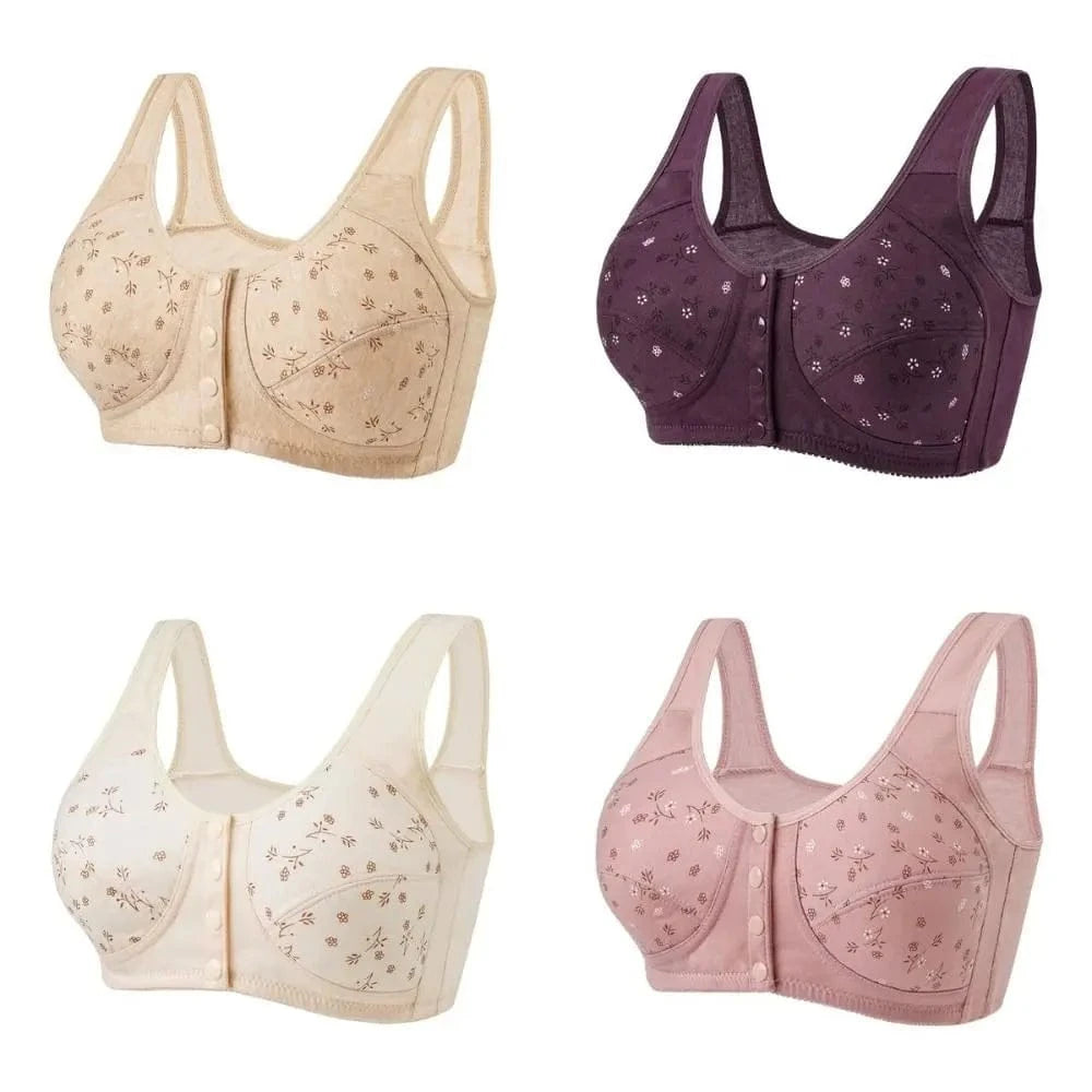 Four women's front-closure bras with floral prints are displayed in beige, dark purple, cream, and dusty pink, all featuring wide shoulder straps and a buttoned front design.