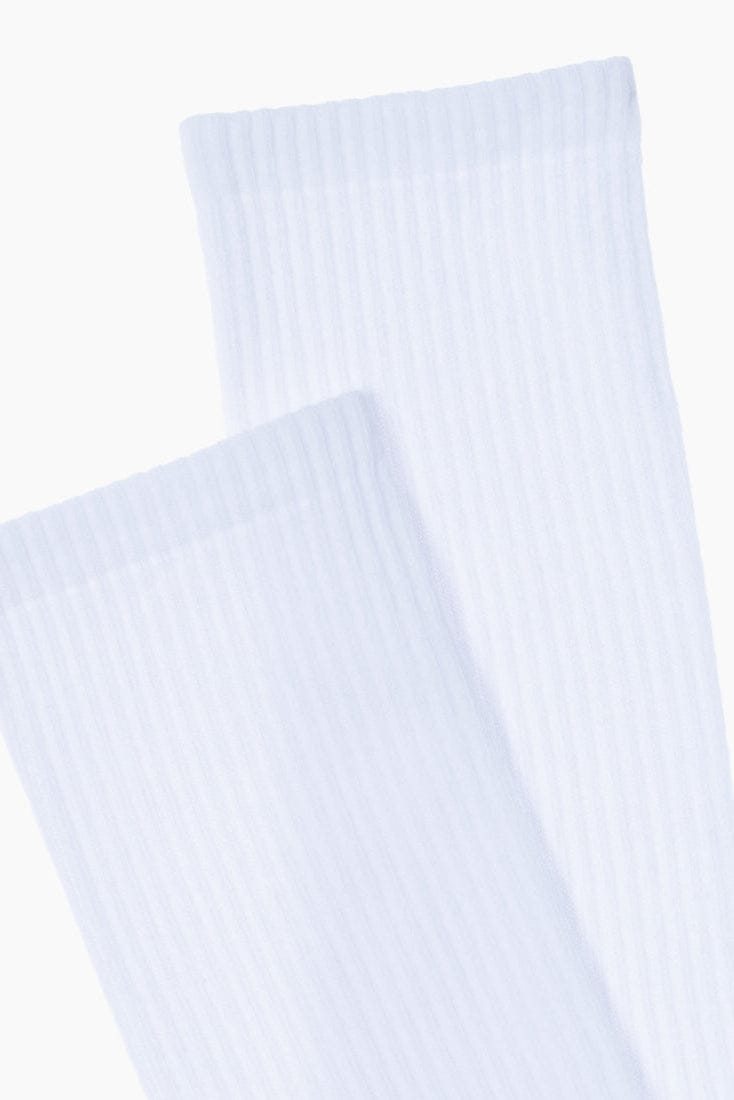 A pair of white ribbed crew socks shown partially overlapping against a plain white background.