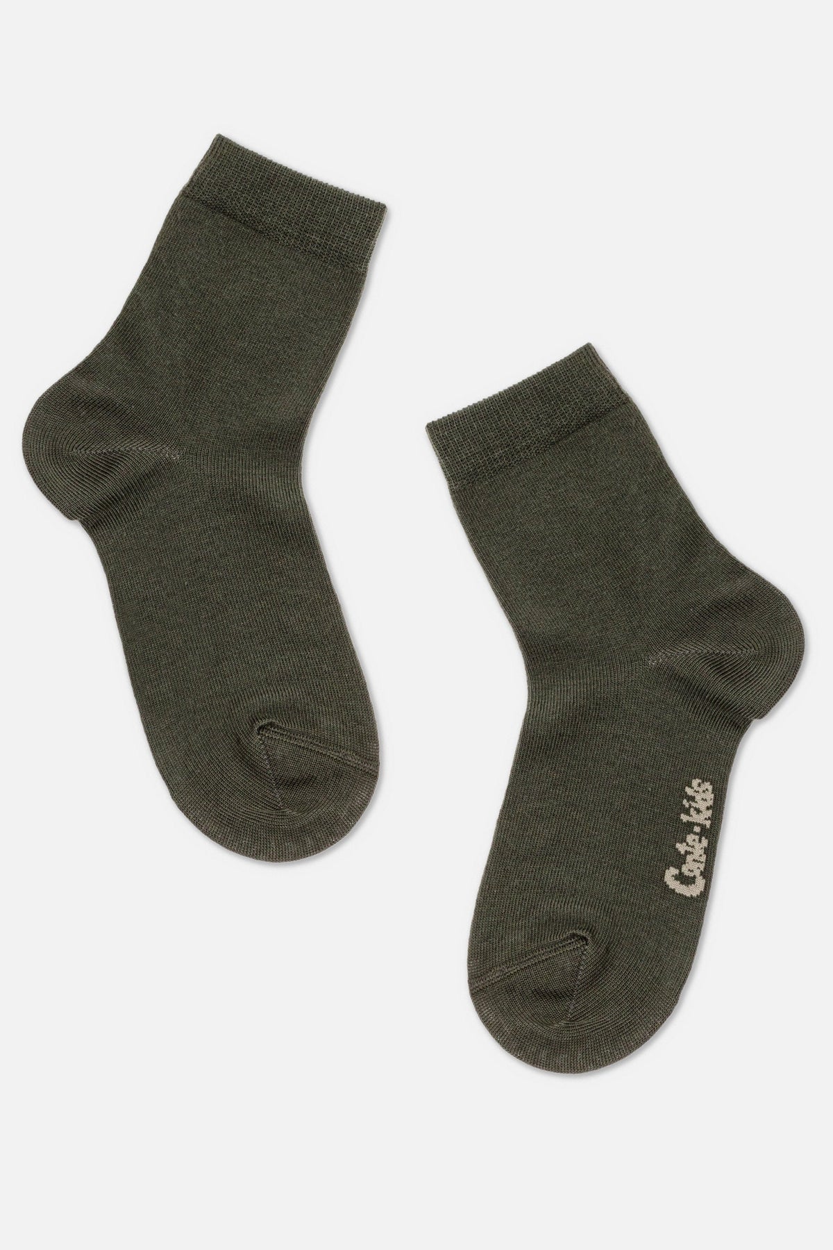 A pair of dark olive green crew-length socks with a small white logo near the toe of the right sock.
