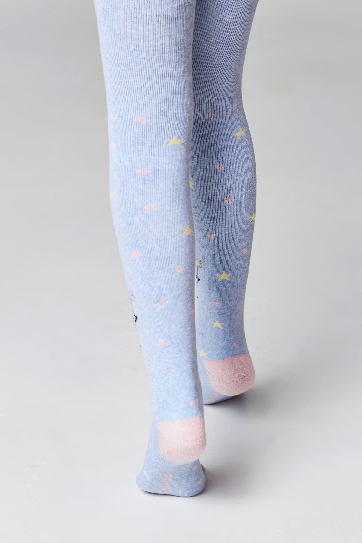 A pair of light blue ribbed tights featuring a repeating pattern of small pastel-colored stars and circles, finished with solid pink heels and toes.