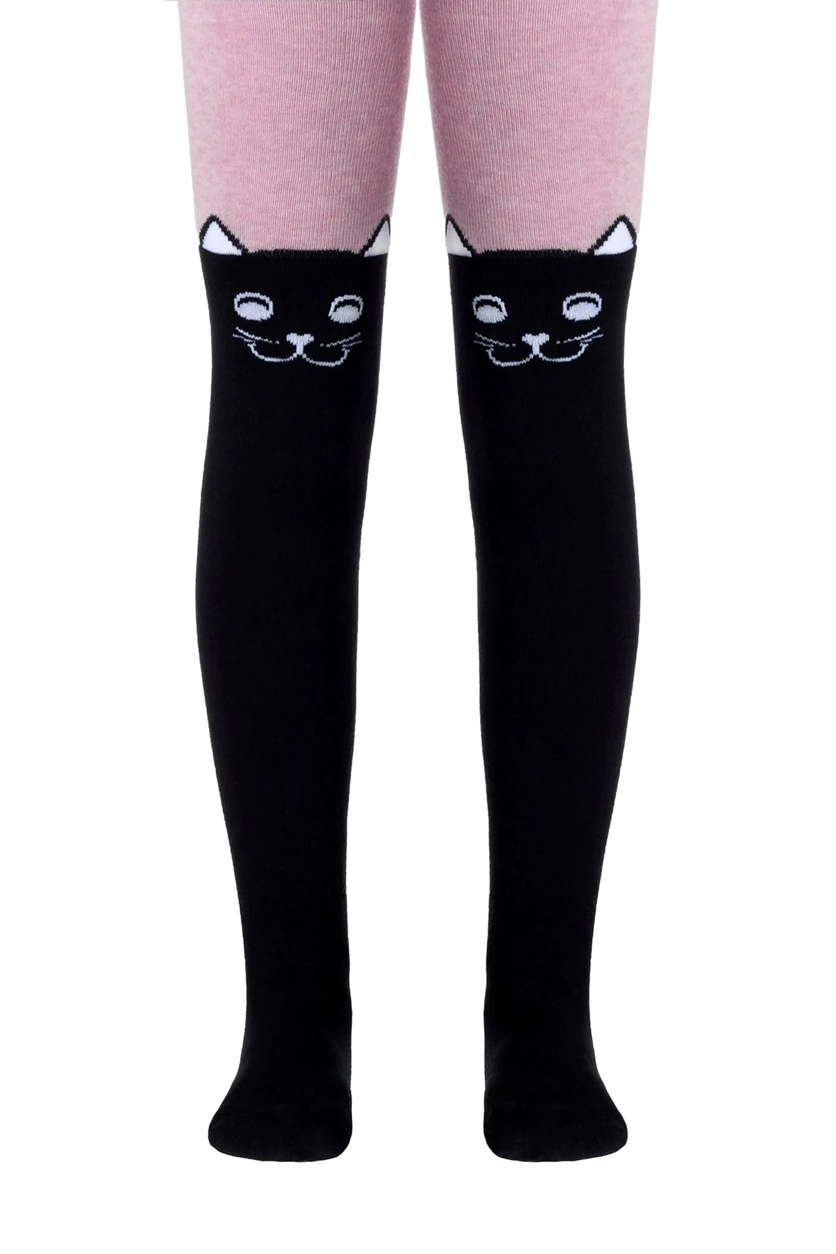 Over-the-knee socks feature a solid black leg and foot with a white cartoon cat face design positioned just above the knee, worn over light pink leggings.