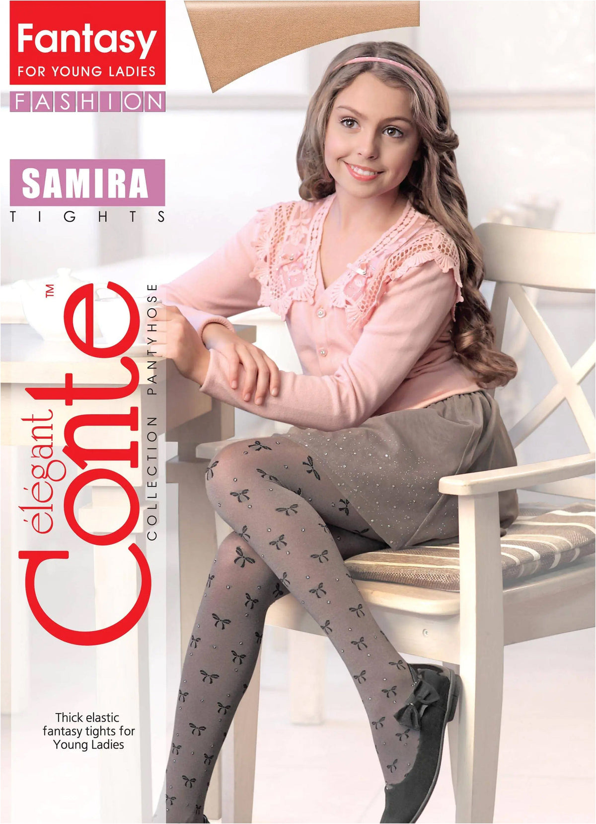 Gray patterned tights featuring small black bows and subtle glitter accents worn by a young girl sitting in a white chair.