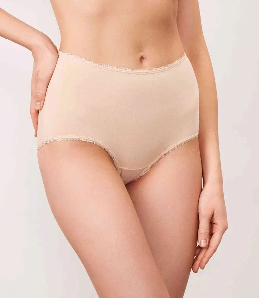 Beige high-waisted briefs with decorative stitching along the waistband and leg openings worn by a person.
