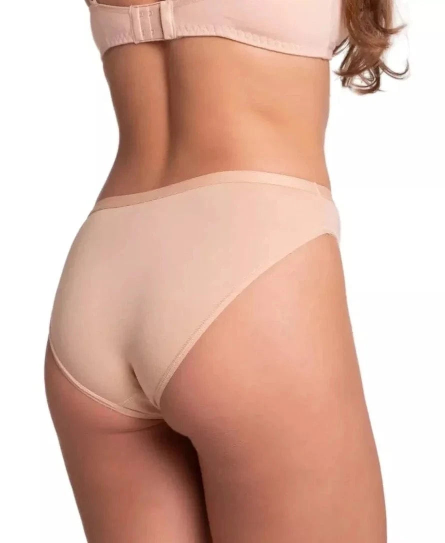 A pair of nude-colored bikini-cut underwear viewed from behind on a person wearing a matching bra.