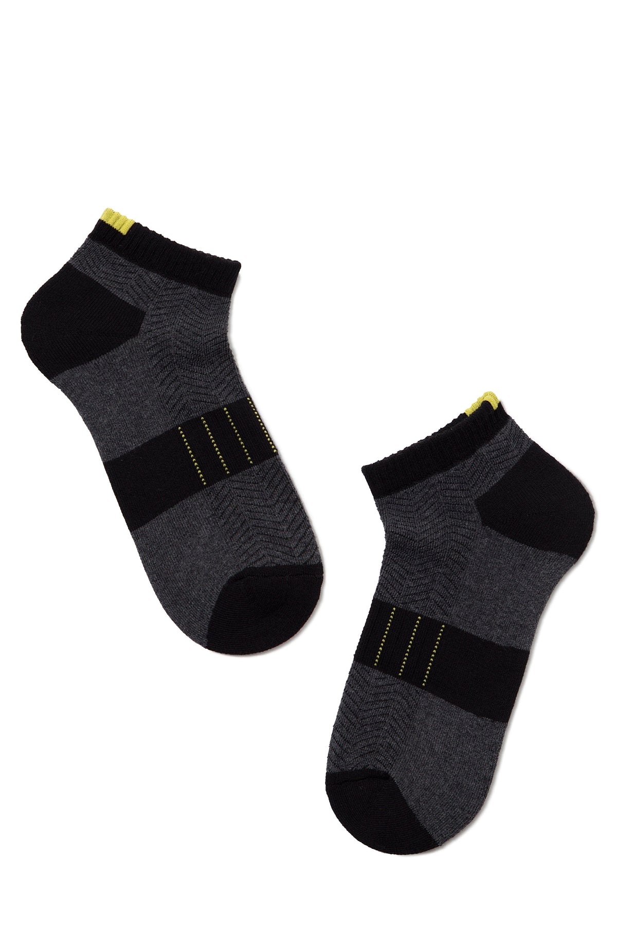 A pair of ankle-length socks in black and charcoal gray featuring a herringbone pattern, horizontal stripes, and small yellow accents at the cuffs and mid-foot.