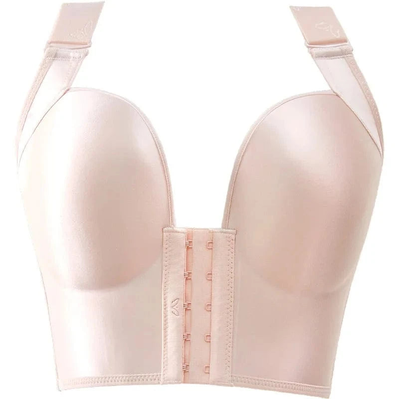 A light pink, strapless-style bra with a front hook-and-eye closure, wide underband, and detachable shoulder straps.