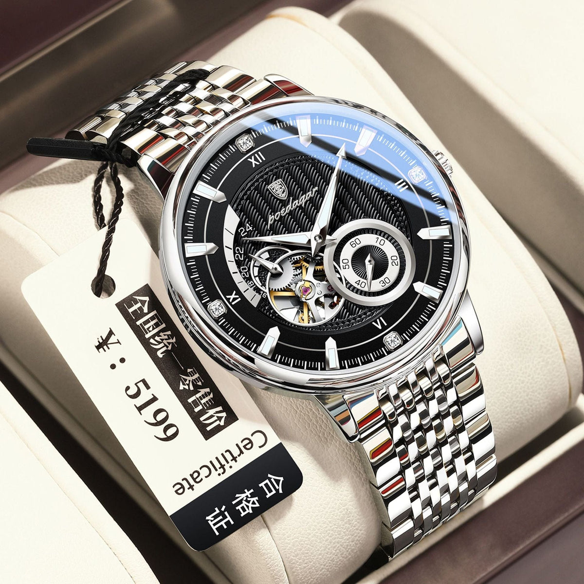 A silver-toned stainless steel wristwatch with a black round face featuring skeleton cutouts, white markers, and a matching metallic link band resting on a padded display cushion.