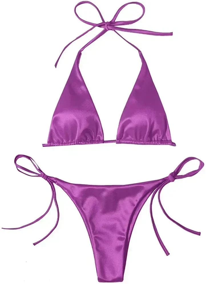 A vibrant purple satin bikini set consisting of a triangle top with tie straps and matching side-tie cheeky bottoms.