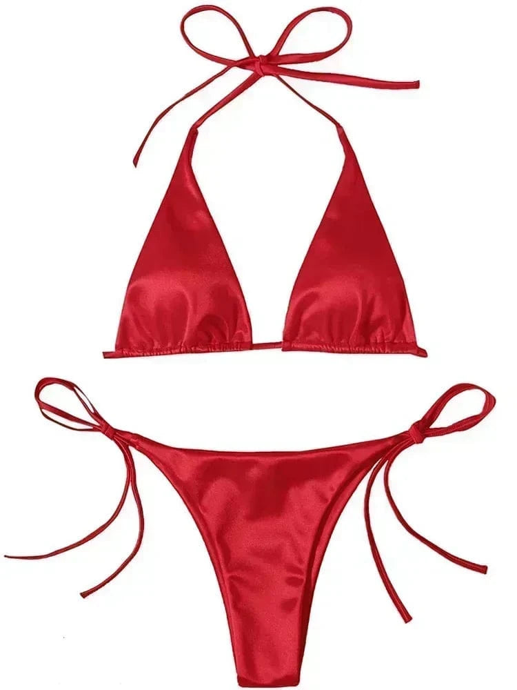 A vibrant red two-piece bikini featuring a triangle top with tie-neck straps and matching high-cut bottoms with side tie closures.
