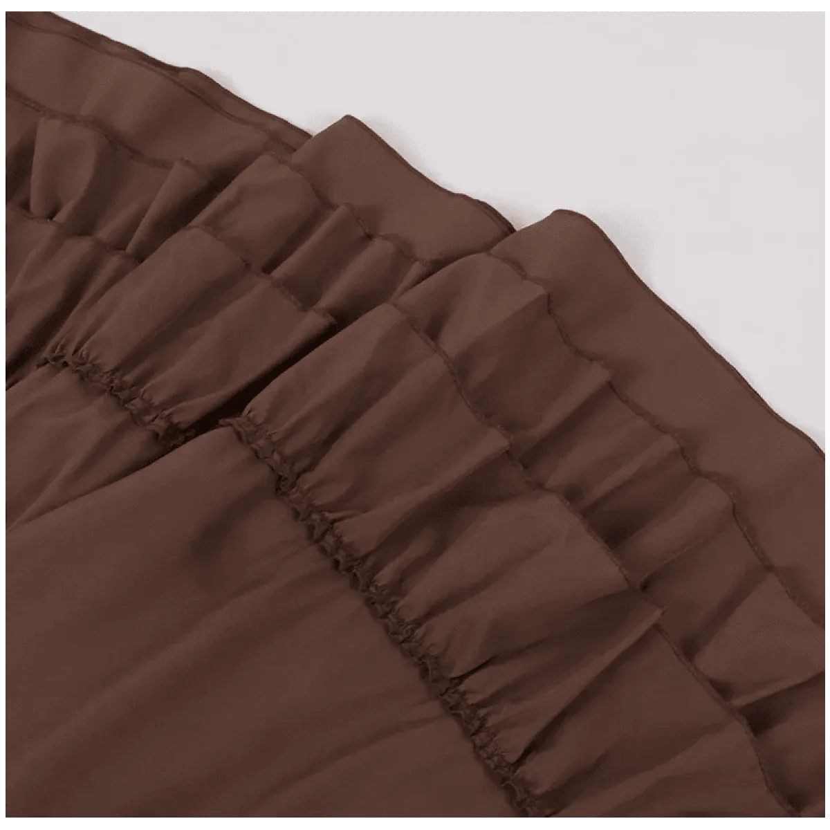 A brown skirt featuring multiple layers of ruffled fabric with gathered seams.