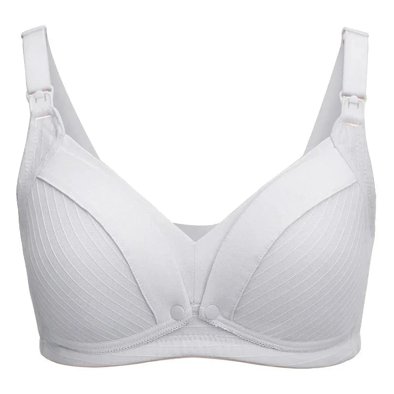 A white nursing bra features wide adjustable straps with front clips, textured ribbed cups, and small snap closures at the center bridge.