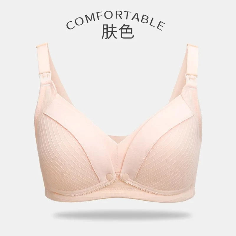 A beige nursing bra with adjustable straps, textured fabric on the cups, and small nursing clasps at the top of the straps against a plain light gray background.