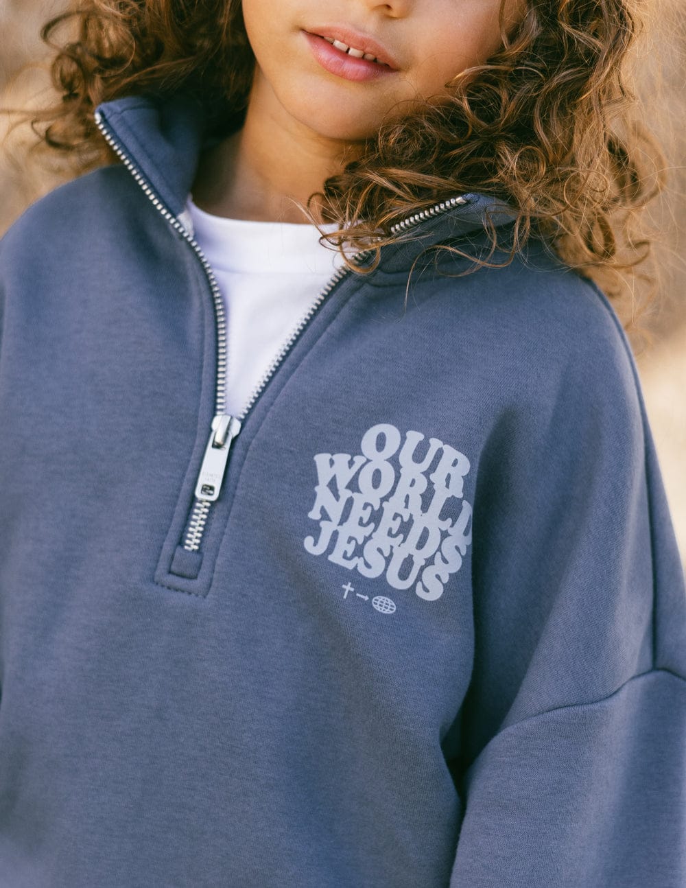 Our World Needs Jesus Kids Half-Zip - A-1 Thread Vault