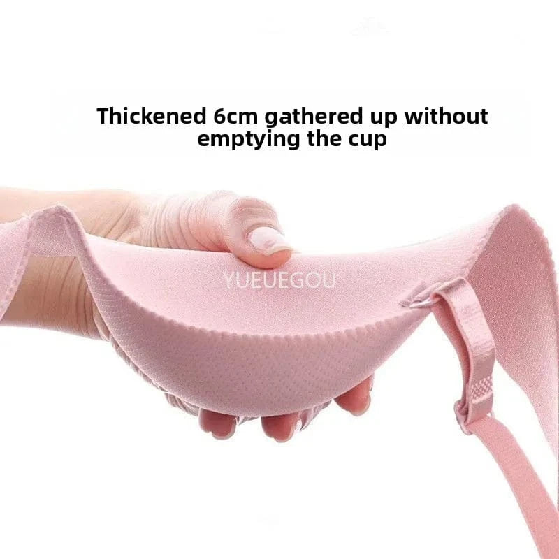 A light pink bra cup held by a hand showing its thick padded structure and the text Thickened 6cm gathered up without emptying the cup overlaid above it.
