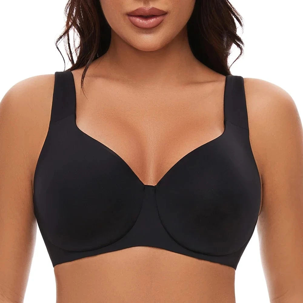 A black full-coverage bra with wide shoulder straps and a smooth, minimalist design worn by a person.