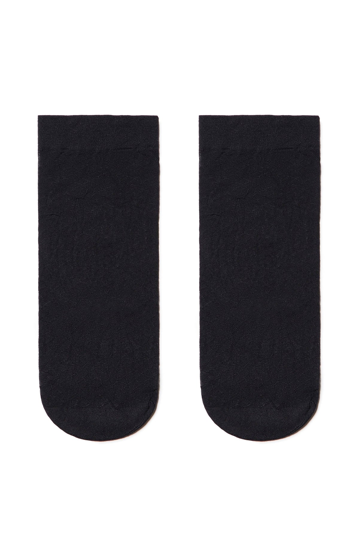A pair of sheer black ankle socks laid flat against a white background.