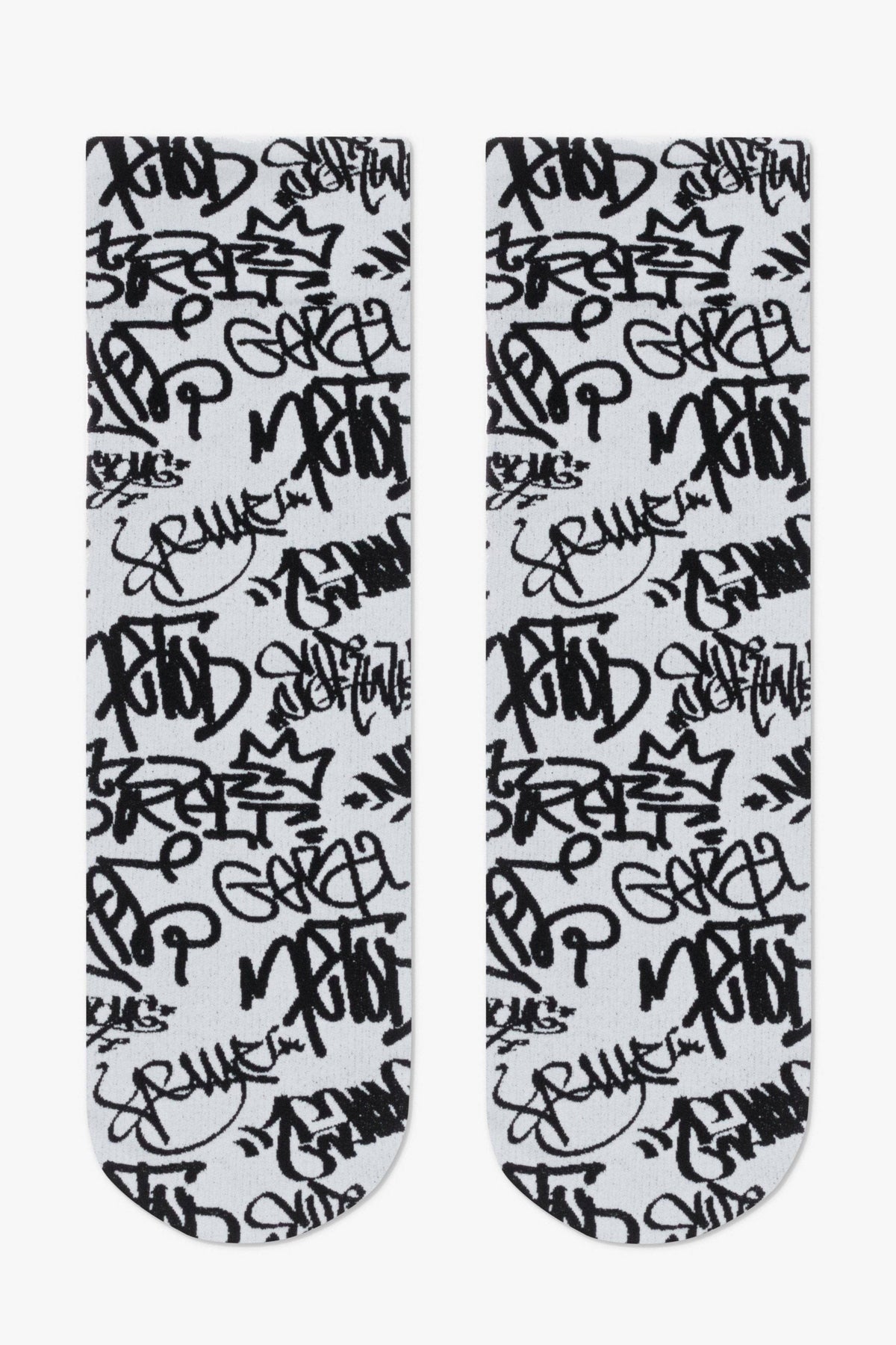 A pair of crew-length socks featuring a repeating black graffiti-style tag pattern on a light grey background.