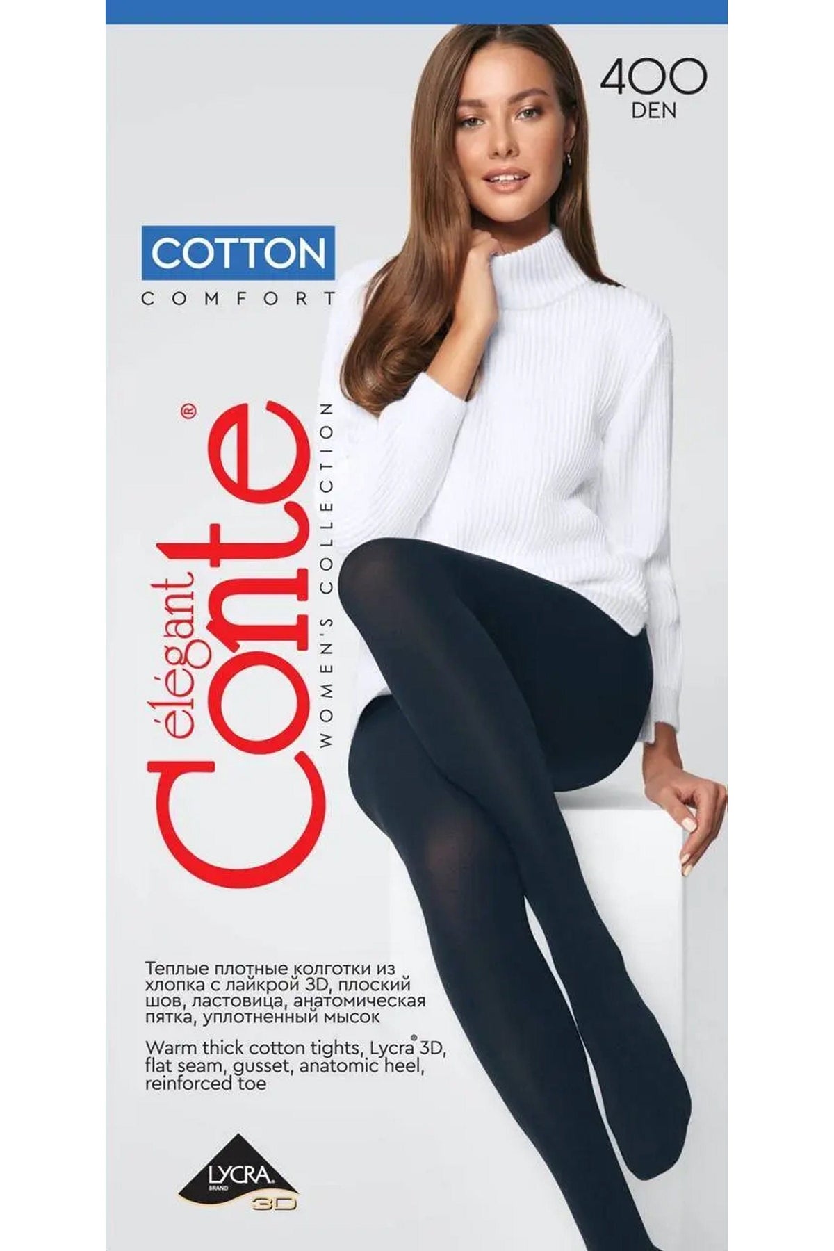 A woman wearing thick black opaque tights sits on a white block wearing a white ribbed turtleneck sweater.