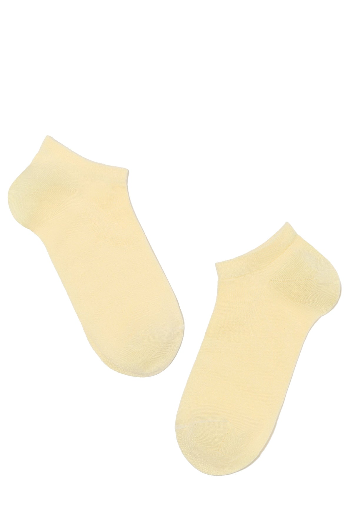 A pair of light yellow low-cut ankle socks laid flat against a white background.