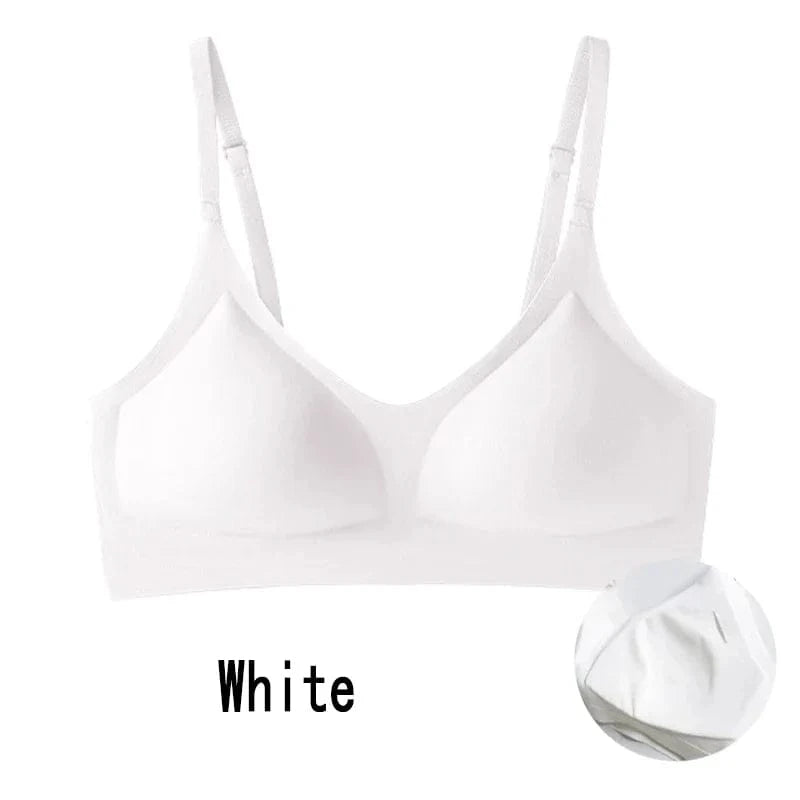 A white seamless wire-free bra with thin adjustable straps, featuring moulded cups and a clean, minimalist design.