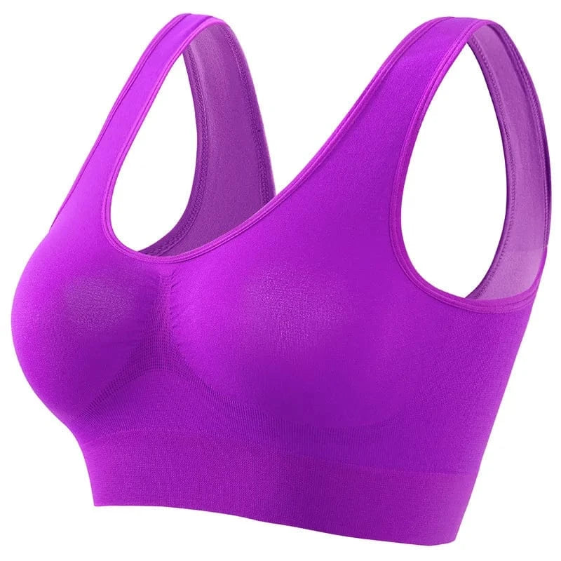 A vibrant purple seamless sports bra with thick shoulder straps and a wide, ribbed underbust band.