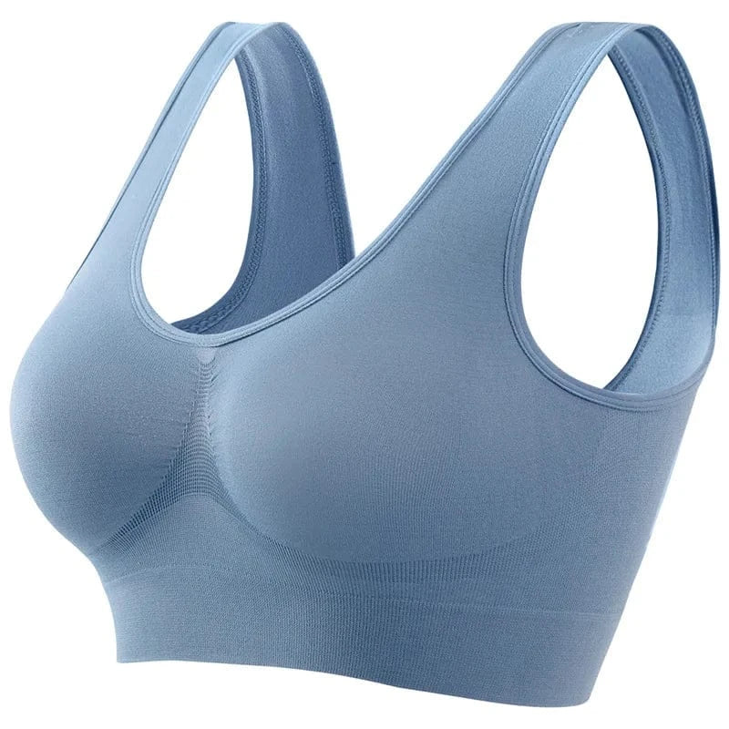 A seamless light blue sports bra with a scooped neckline and wide shoulder straps shown against a plain white background.