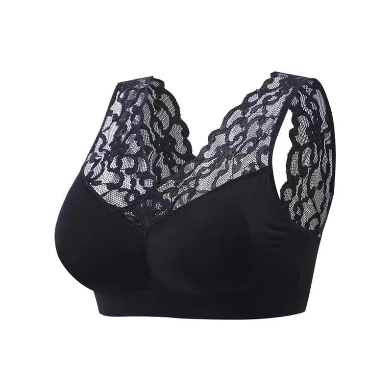A black wireless bra featuring a solid opaque base and a V-neckline overlaid with decorative black lace that extends to the shoulder straps.