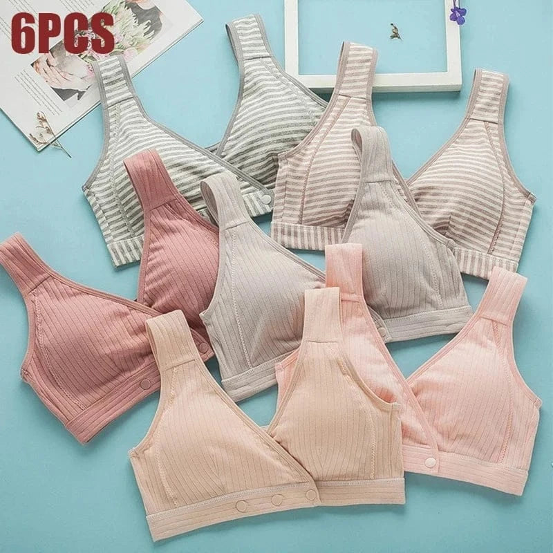 A set of six wireless bralettes in various shades of pink, beige, and grey with striped or solid ribbed patterns, laid out flat on a light blue background.