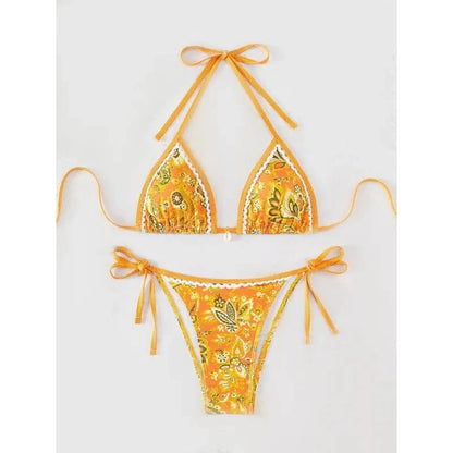 A two-piece bikini set in a vibrant orange paisley pattern with white scalloped trim and side tie closures on the bottoms.