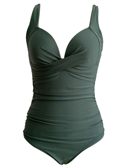A dark olive green one-piece swimsuit featuring a V-neckline with a crossed-front design and ruched detailing throughout the bodice.