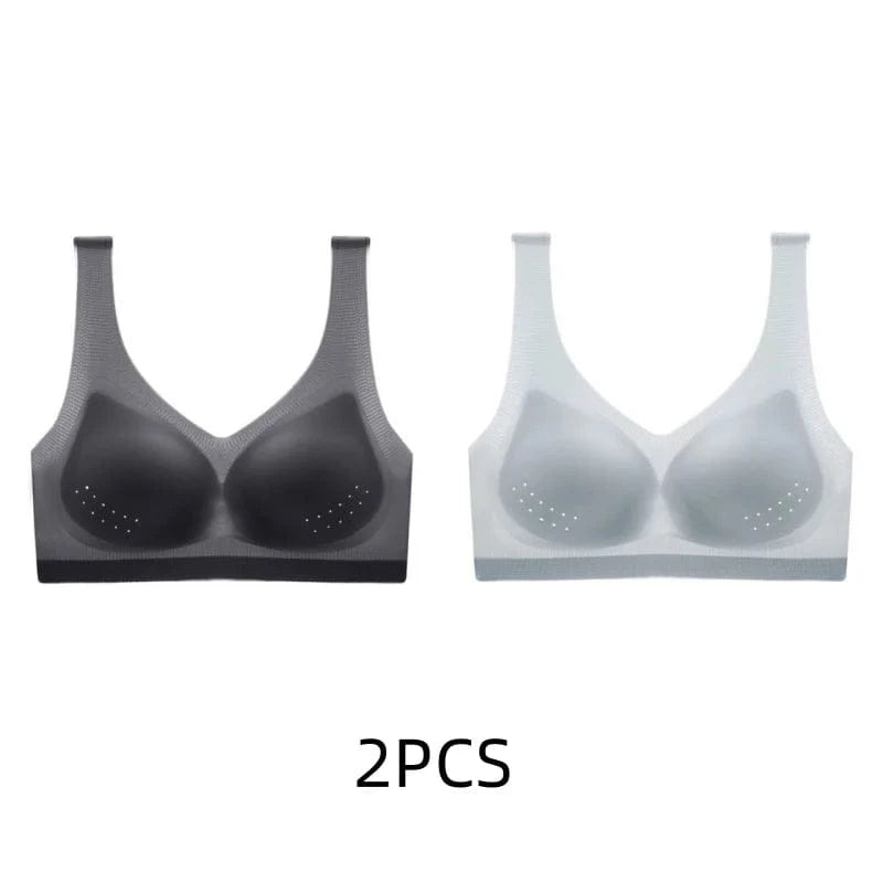 Two seamless wireless bras, one black and one light grey, are displayed against a plain background with the text 2PCS printed below them.