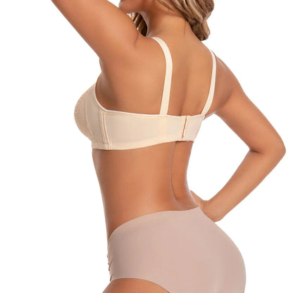A beige bra and matching panties worn by a woman seen from the back, featuring a textured lace-trimmed cup, adjustable shoulder straps, and a simple back hook-and-eye closure.