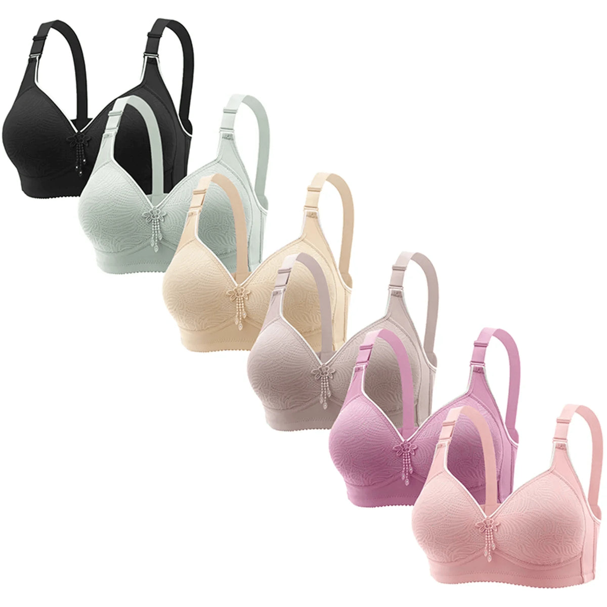 Six wireless bras with textured cups and a small beaded embellishment at the center gore are displayed in a cascading row, ranging in color from black to mint, beige, mauve, plum, and pink.