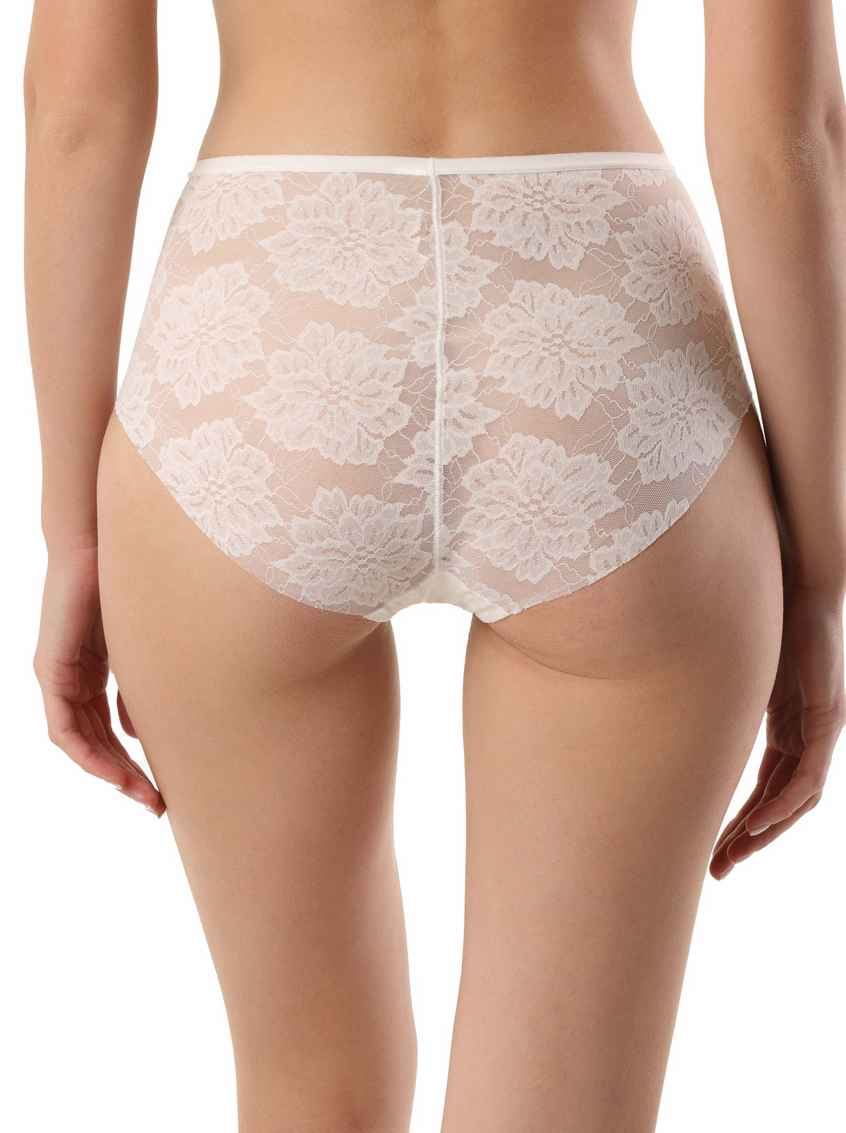 A back view of a person wearing white floral lace briefs with a high-cut design.