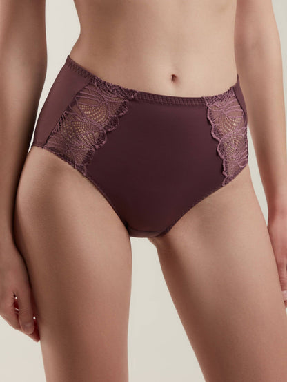 Dark purple high-waisted briefs featuring decorative lace side panels on a model.
