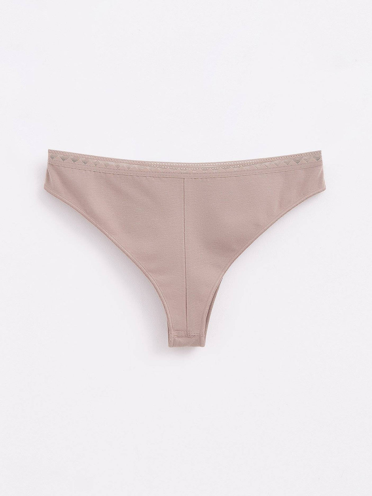 A pair of light brown thong panties with a decorative patterned trim along the waistband.