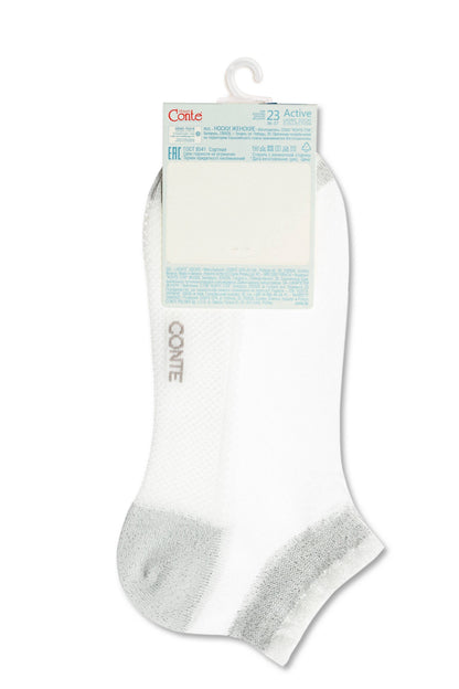A pair of white ankle socks with a metallic silver heel and toe patch, attached to a branded paper packaging header.