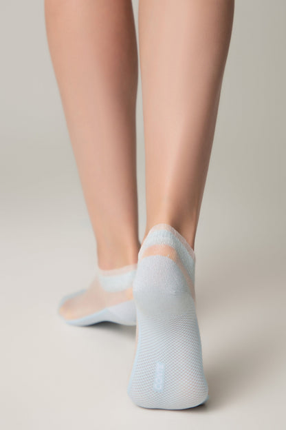 Light blue low-cut sheer ankle socks with a subtle horizontal stripe detail worn on a pair of legs against a plain light gray background.