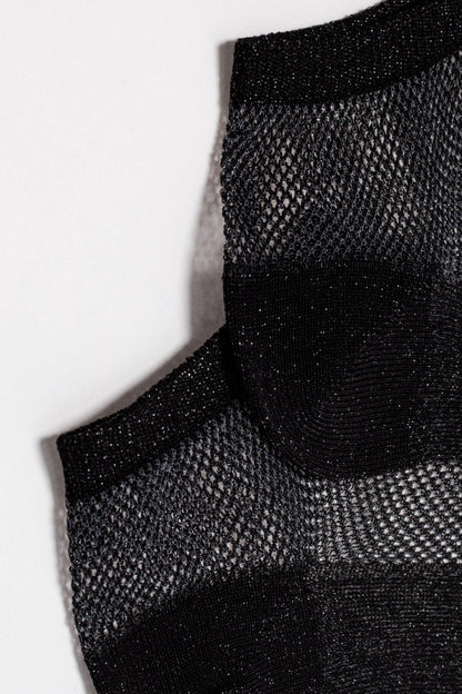 A close-up of a black metallic ankle sock featuring a textured mesh pattern with solid horizontal stripes.