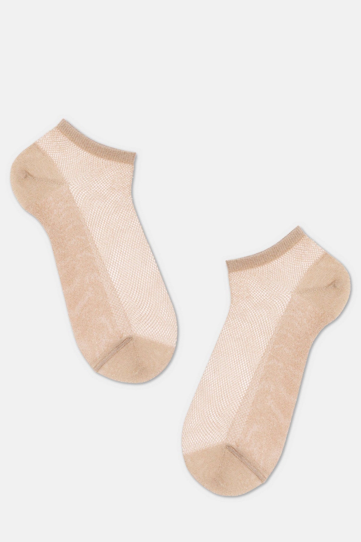A pair of beige ankle-length socks with a sheer, mesh-like knit texture against a plain light gray background.