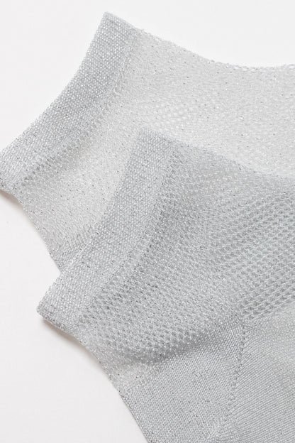 A pair of sheer, metallic silver ankle socks featuring a fine mesh texture against a plain white background.