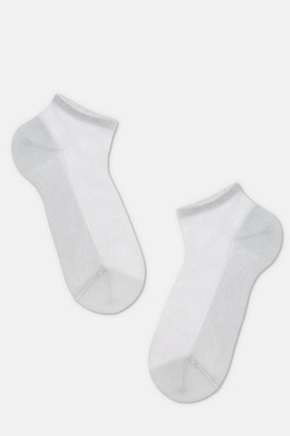 A pair of sheer, light grey ankle socks displayed against a plain background.