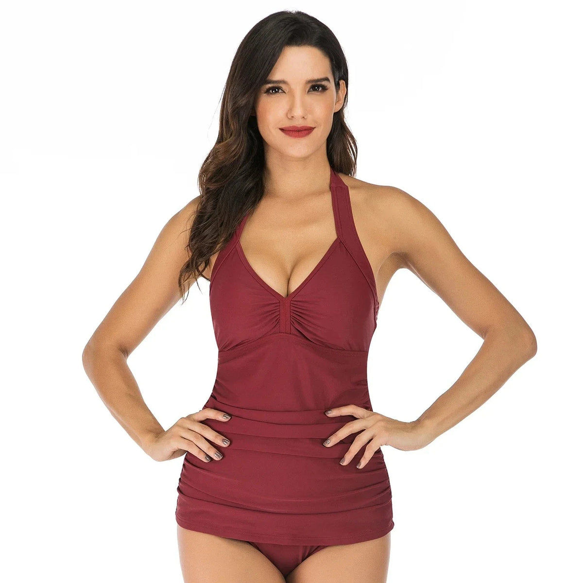 A woman models a dark red halter-neck tankini top with gathered fabric detailing at the center bust and hem.