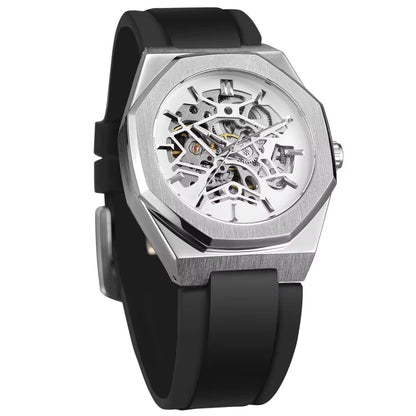 A skeleton watch featuring a silver-toned octagonal case with a white inner dial, exposed mechanical components, and a smooth black silicone strap.