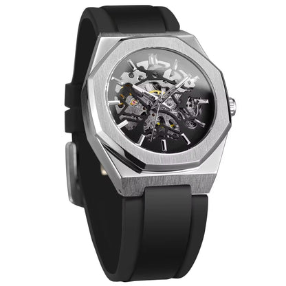 A skeleton watch with an octagonal silver metal bezel and a black rubber strap, showcasing the intricate inner mechanical movement.