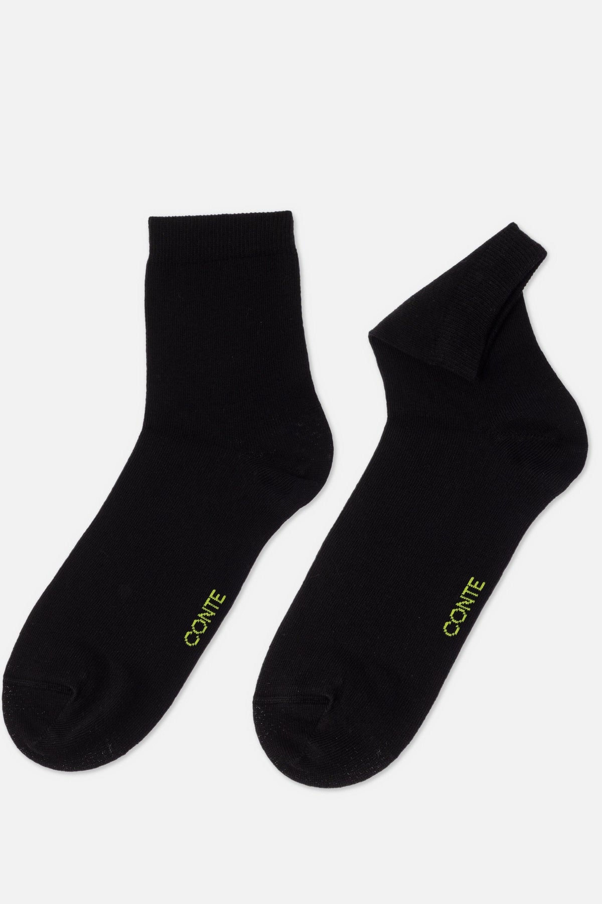 A pair of black ankle socks featuring the word CONTE in yellow text near the toe, set against a plain light background.